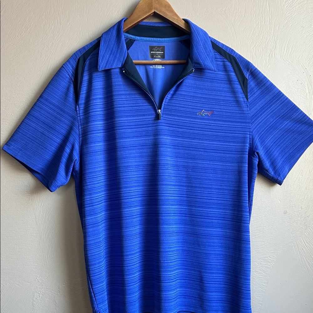 Greg Norman Men's Blue Polo Shirt. Size Large.